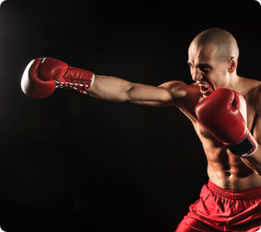 Boxer in red gloves punching